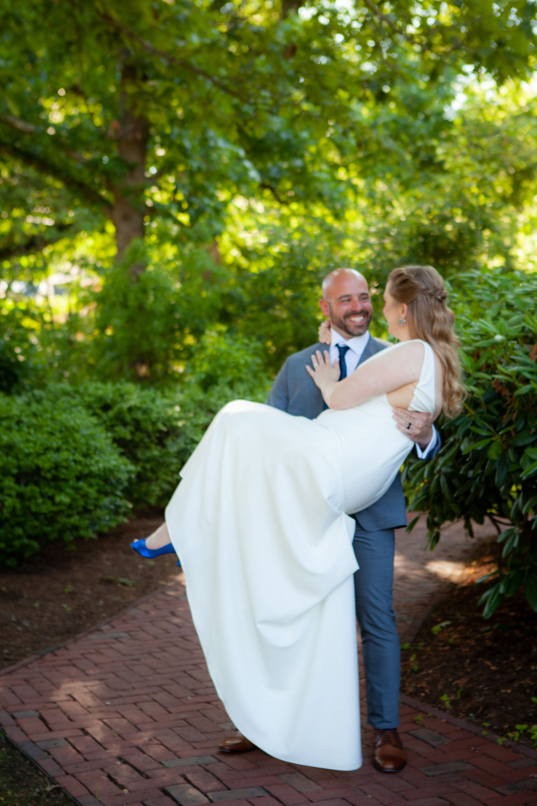 Groom carrying bride